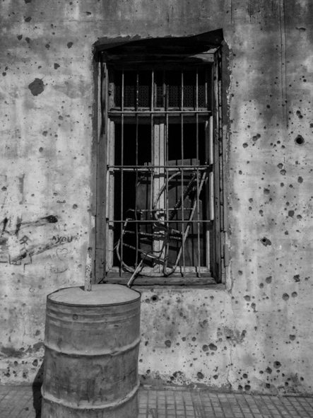 Walls riddled with bullet holes, Beirut